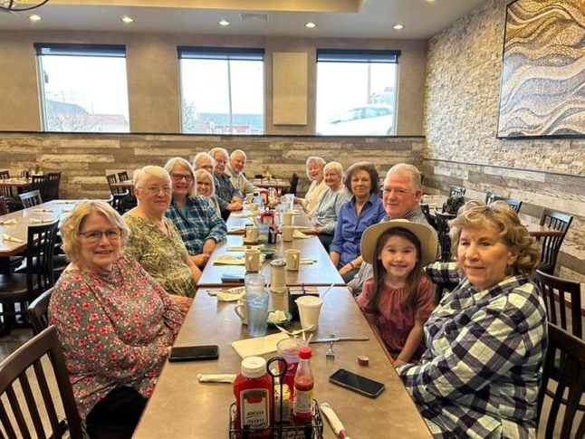 May be an image of 10 people, people sitting and indoor