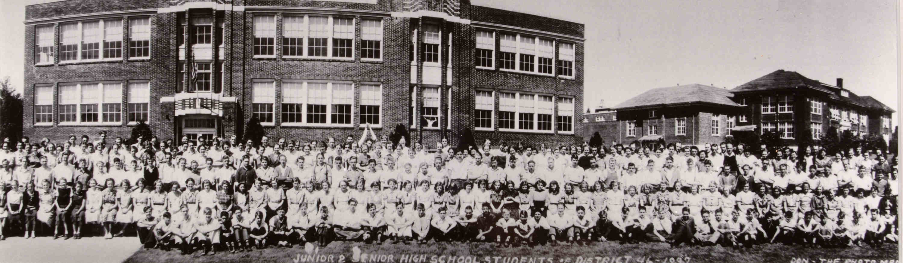 Bothell Junior High School with the High School to the right, students from both schools, 1937