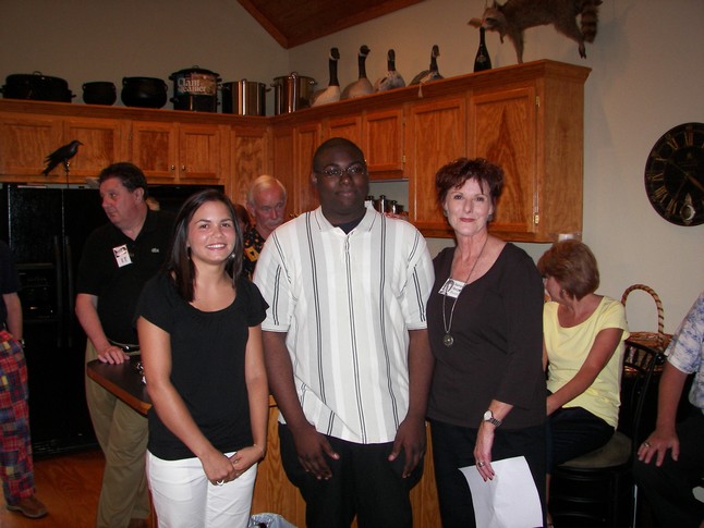 Allyssa Tilghman and Erick Edwards with Harvey Sharp Wooten