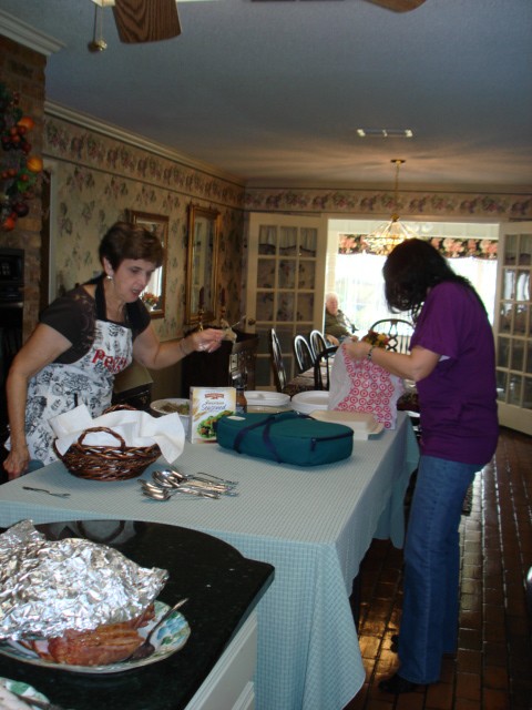 Peggy and Cyndi setting up the spread 